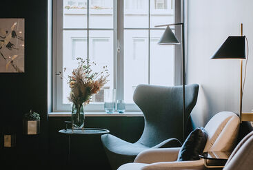Cozy waiting room with armchairs and small table