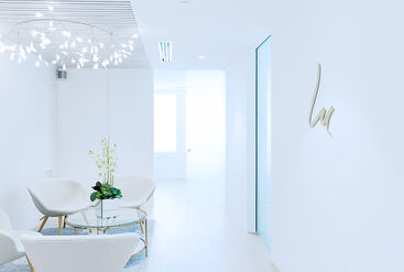 Waiting area with desk and chairs in a dental practice.