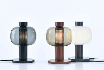 Trio of designer lamps in the style of Japanese paper lanterns used to light the paths leading to shrines