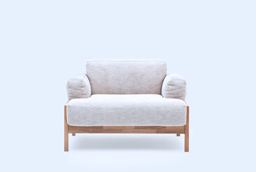 Sofa with ample cushioning, wooden frame, and a low seat height
